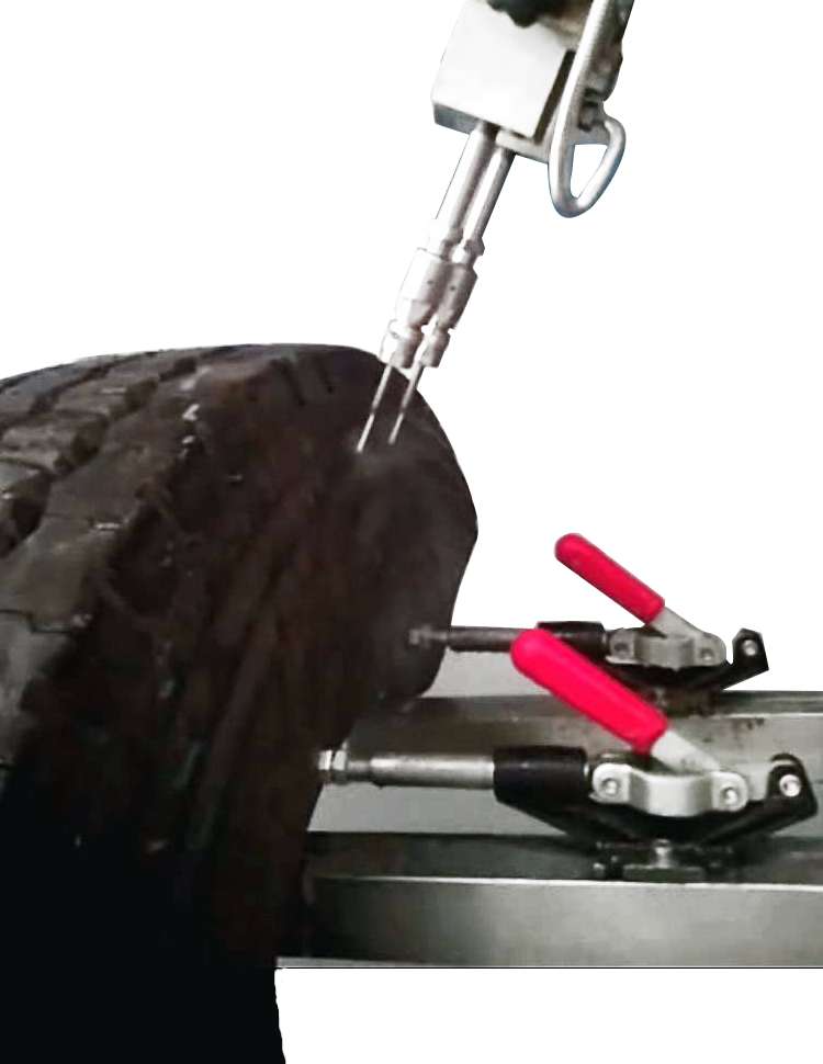 waterjet cuts a strip of tire